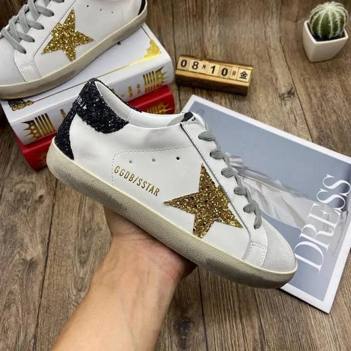 Golden Goose Gold / Black tenisice — bočni prikaz