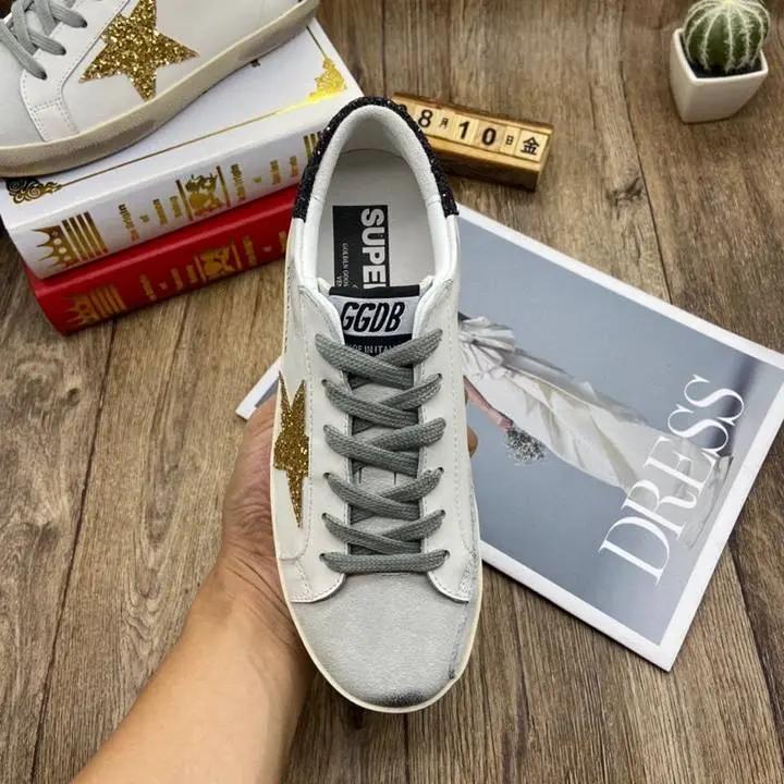 Golden Goose Gold / Black tenisice — detalj